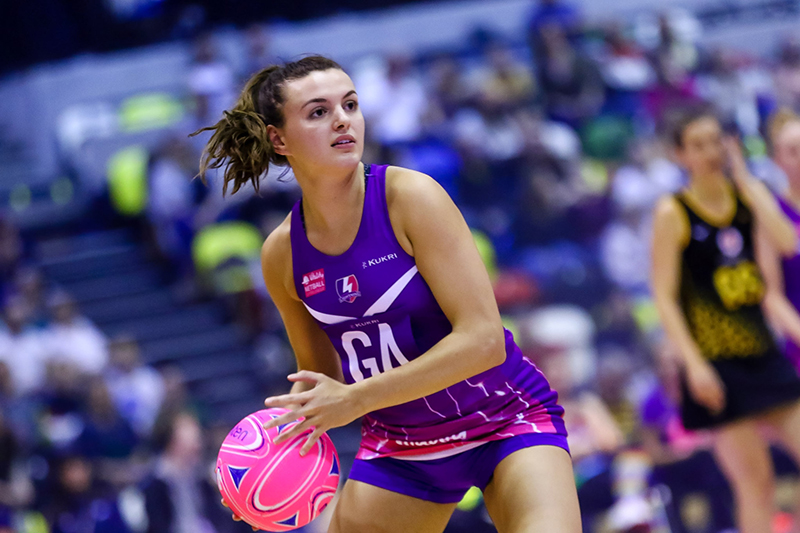 a netball player holding the ball